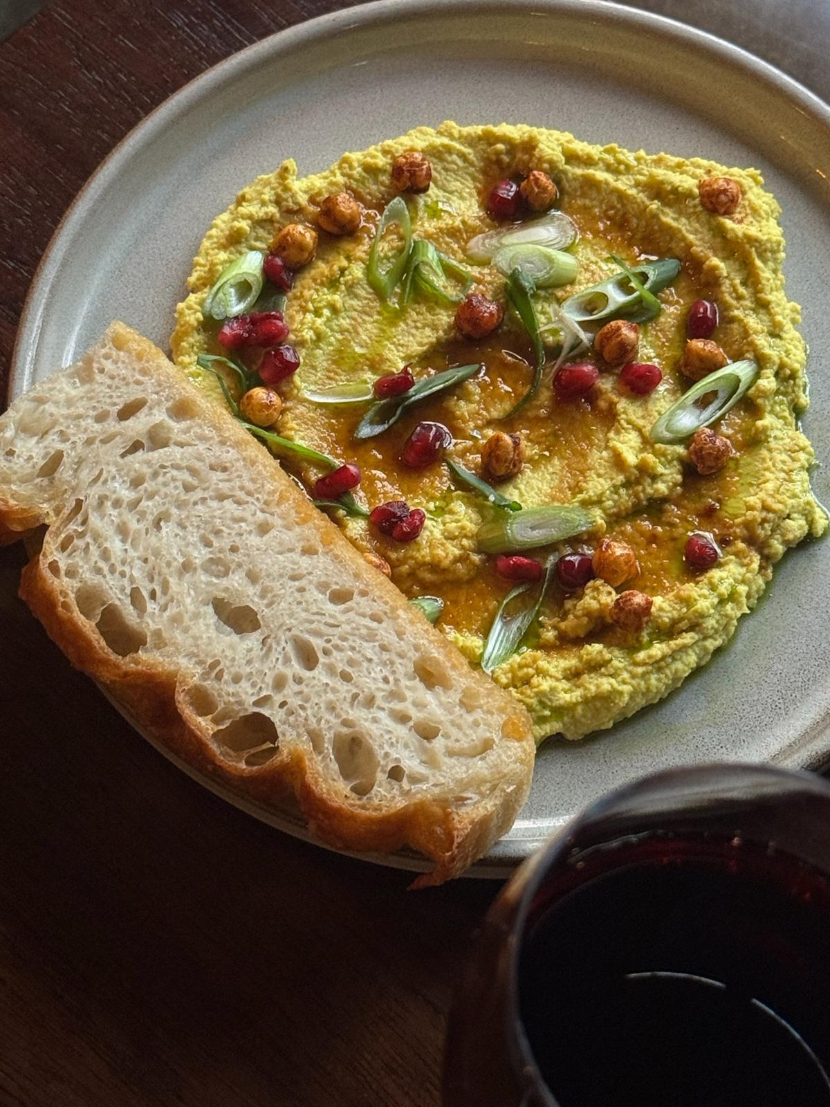 Chickpea, spring onion, pomegranate, green oil, grilled focaccia at The Legal Eagle